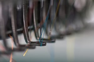 the embroidery needle with thread are ready to work ** Note: Visible grain at 100%, best at smaller sizes